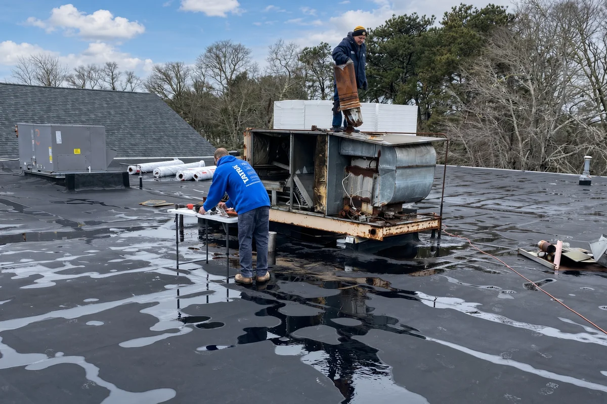 Tatra crew replacing a rooftop HVAC unit on a commercial building
