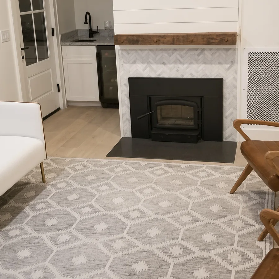 Wood-burning insert with marble herringbone surround and shiplap chimney breast